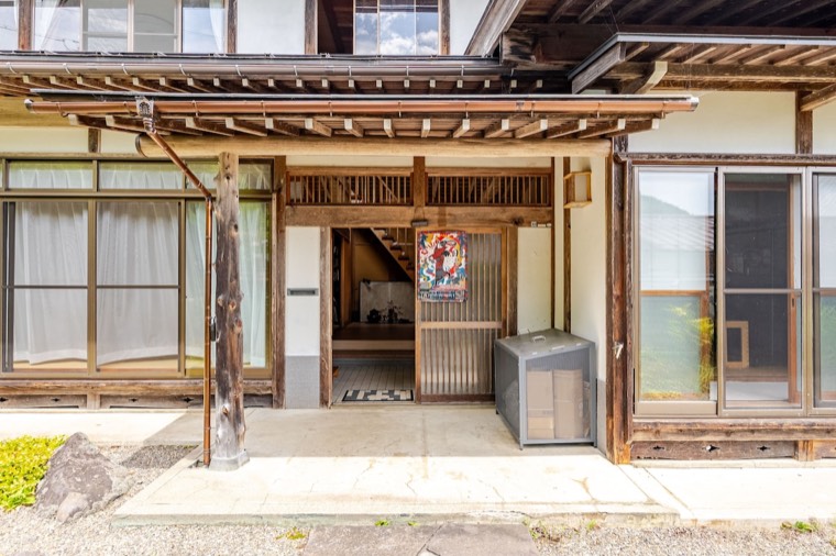 The entrance beneath its timber porch