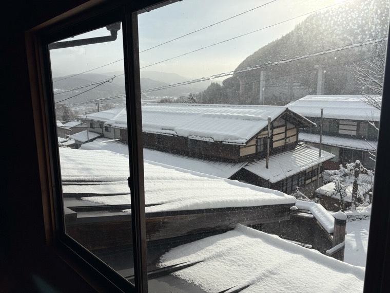 First light on the snowed-in roofs