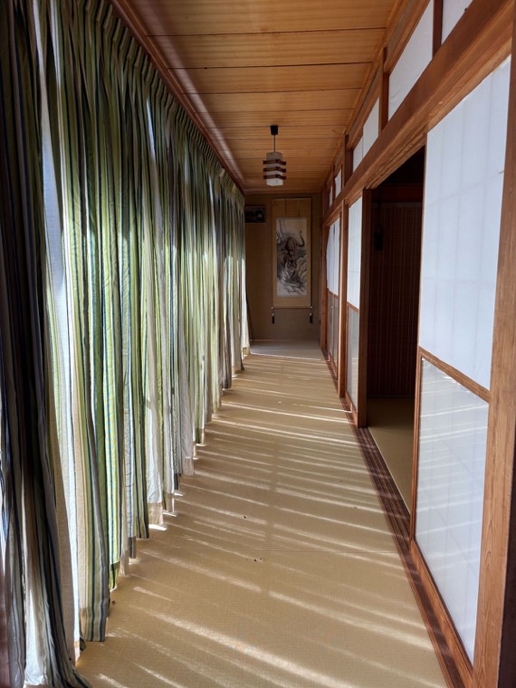 The glazed corridor along the rooms